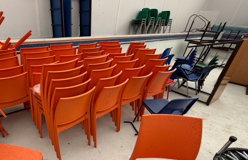 green stacked office chairs